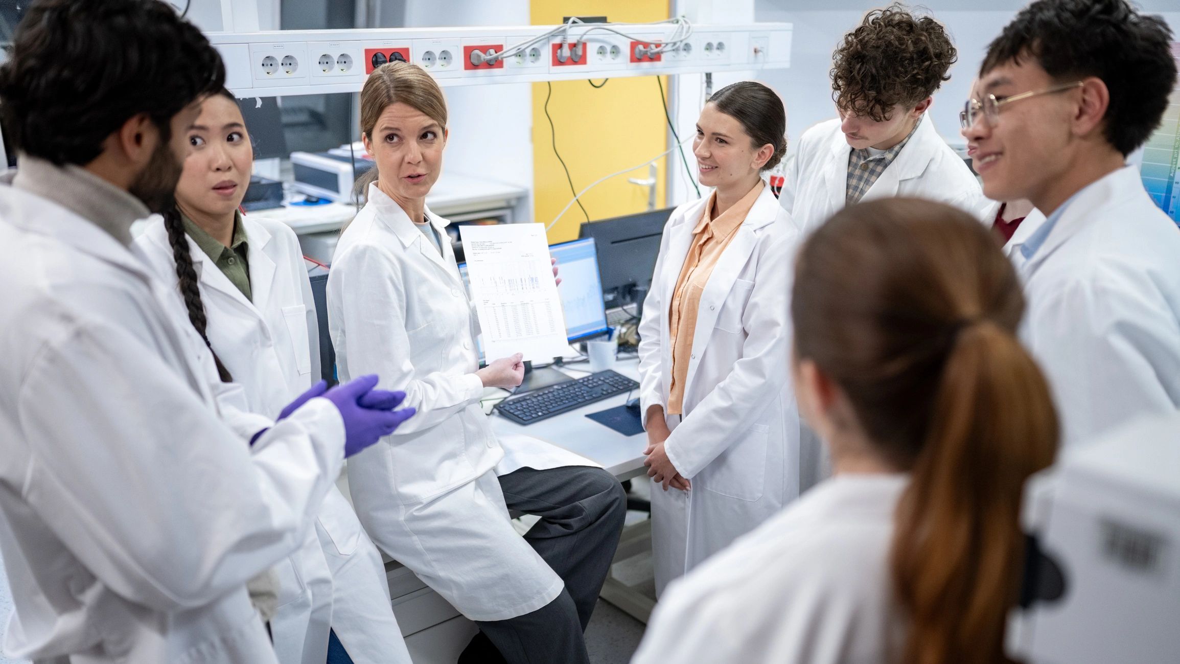Scientists collaborating in a modern biotechnology laboratory
